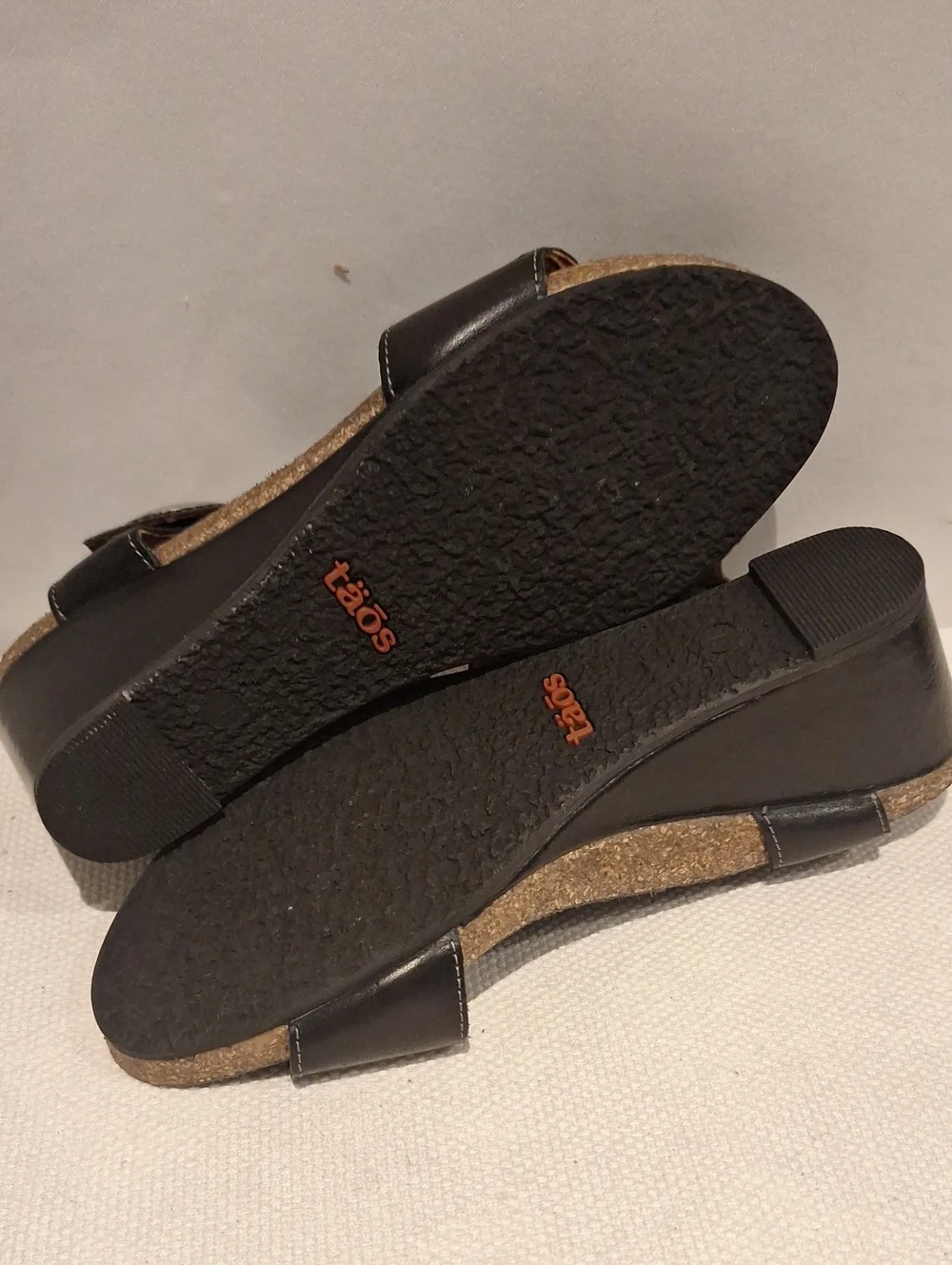 Taos Carousel 2 Black Leather Two-Strap Wedge Sandals With Silver Medalion